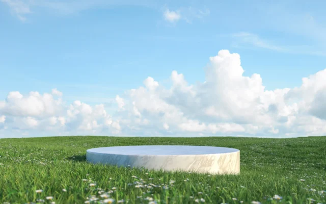 3D rendering marble podium backdrop with grass field sky background