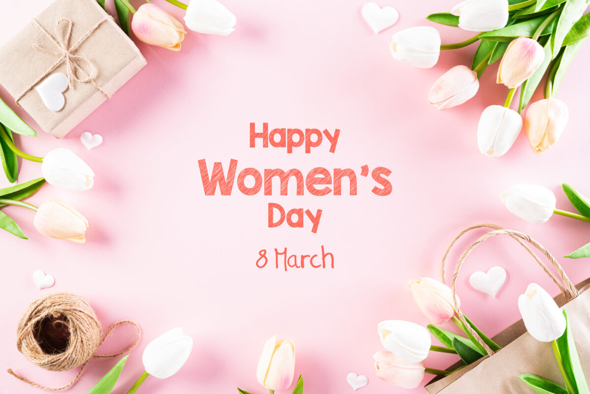 International Women's Day concept. Pink and white tulips with gift